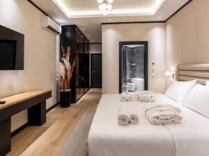 a hotel room with two beds and a television at 7 Star Apartments in Tashkent