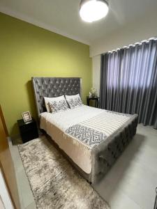 a bedroom with a large bed and a large window at Furnished two-bedroom apartment DN in Solorín +17 photos