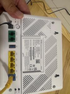 a persons hand holding a piece of circuitry on top of a laptop at Apartamento Centro in Rubí