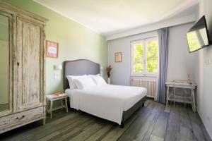 Llit o llits en una habitació de Hotel Villa Bonelli