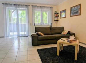 a living room with a couch and a coffee table at Welcome in Weilerbach in Weilerbach