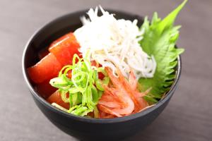 a bowl of food with carrots and other vegetables at Dormy Inn Express Kakegawa in Kakegawa
