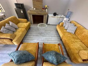 a living room with two couches and a fireplace at Bella Pollito in Nairobi
