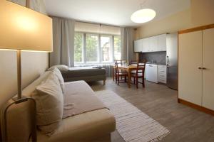 a living room with a couch and a table at Libušina Villa in Kutná Hora
