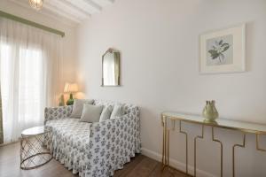 a living room with a couch and a table at Despotiko Hotel in Mikonos