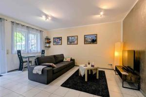 a living room with a couch and a table at Welcome in Weilerbach in Weilerbach