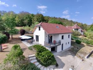 an aerial view of a white house with a red roof at Le Balcon de Narlay in Le Frasnois