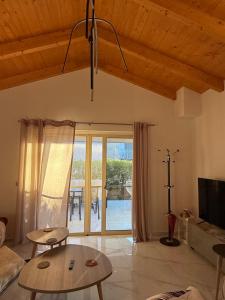 a living room with a couch and a table at Makis & Lena's Home in Svoronata