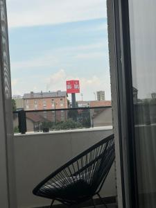 a bench sitting on top of a balcony at Omnia Lux Apartman 4C in Šabac