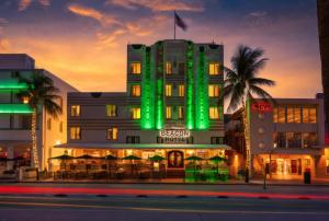 a hotel with green lights on the side of it at Beacon South Beach Hotel in Miami Beach