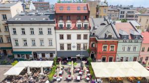 an overhead view of a city with tables and buildings at Hotel Rubinstein in Krakow