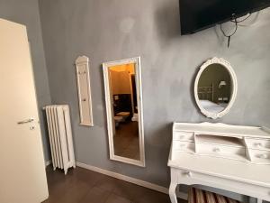 a bathroom with a white vanity and a mirror at Boutique Hotel Washington Milano - JCUBE HOTELLERIE in Milan +22 photos
