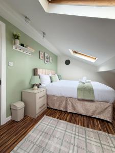 a bedroom with a large bed and a rug at Brit Rooms Manchester in Manchester