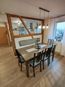a dining room with a table and chairs at Apartment Selina in Lichtenhain