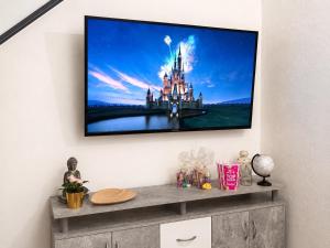 a flat screen tv hanging on a wall at Casa Ada con Terraza Panorámica al Roque Bentayga by Canarias Prime Homes in Tejeda +22 photos