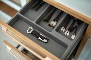 a drawer in a kitchen with utensils at Turtle Tales-Tao Khon in Thai Muang