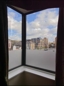 a large window with a view of a city at ICON Hotel in Luton