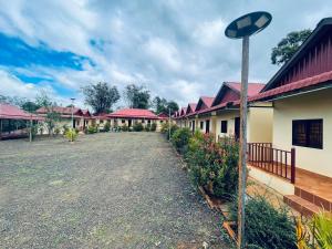 a row of houses with red roofs at Senmonorom in Senmonorom +3 photos