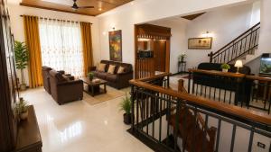 a large living room with couches and a television at The Kandyan Nest in Kundasale