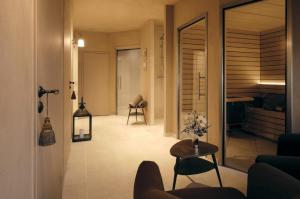 a living room with a couch and a table at Villa Florentine, A Beauvallon Hotel & Spa in Lyon