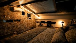 a bedroom with a bed in a room with a desk at Maison LOVEROOM 70m2 L'entre Nous in Grenoble
