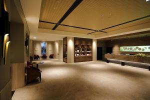 a lobby of a hotel with a waiting room at Hotel Monte Hermana Fukuoka in Fukuoka