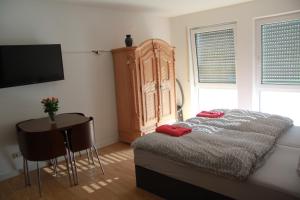 Ένα ή περισσότερα κρεβάτια σε δωμάτιο στο Holiday Apartment Zwinger