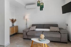 a living room with a couch and a table at Casa Alena in Cervione