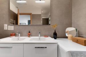 a bathroom with a white sink and a mirror at Casa Alena in Cervione +68 photos