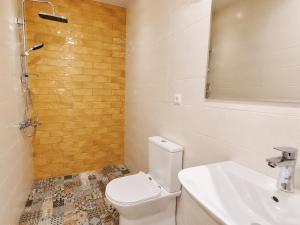 a bathroom with a toilet and a sink and a shower at Garslyan Boutique Hotel in Ninotsminda