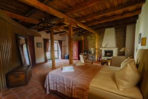 a bedroom with a large bed in a room at Polixenia Culinary Estate 