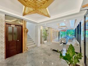 a living room with a gold ceiling at El Jardin Residences in Panglao Island