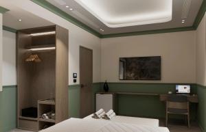 a room with a bed and a desk in it at GRAND SOL LUXURY BOUTIQUE Hotel in Hanoi