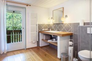 a bathroom with a sink and a toilet at Fuchs und Has' Feldberg in Feldberg +193 photos