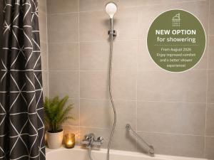 a bathroom with a shower with a shower curtain at Moscow Areal Suite in Baden-Baden +29 photos
