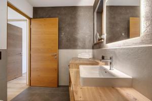 a bathroom with a sink and a mirror at Schartenblick in Sarntal +88 photos