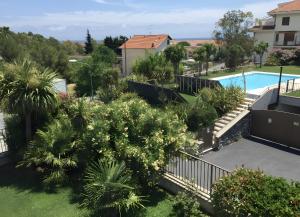 an aerial view of a garden with a swimming pool at Villa di Diana in Diano Castello