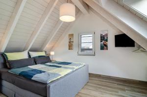 a bedroom with a bed in a attic at Appartment Naturblick in Stockach