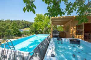 a swimming pool in a backyard with a house at Appartment Naturblick in Stockach
