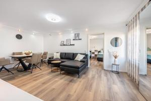 a living room with a couch and a table at Ferienwohnung Marina in Stockach