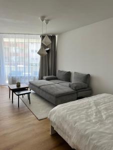 a living room with a couch and a bed at See Sun in Uhldingen-Mühlhofen +14 photos