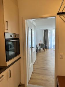 a room with a kitchen and a living room at See Sun in Uhldingen-Mühlhofen