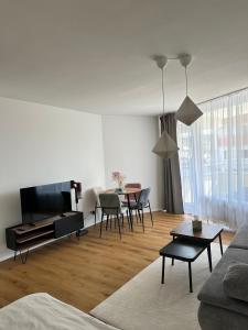 a living room with a couch and a table at See Sun in Uhldingen-Mühlhofen