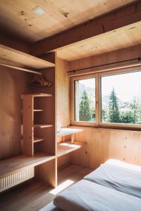 a bedroom with two beds and a window at Ferienhaus Islen in Mellau