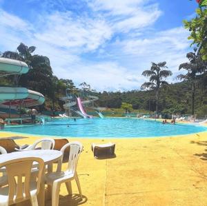 a pool with a water park with a water slide at Old West Water Park in Santo Antônio do Pinhal +38 photos