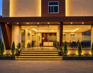 a building with a staircase in front of it at IndiGo Line Hotel - Opp Paradise Biryani Shamshabad in Hyderabad