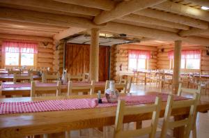 a room with a long wooden table and chairs at Usedlost u rybníka in Velký Bor +48 photos