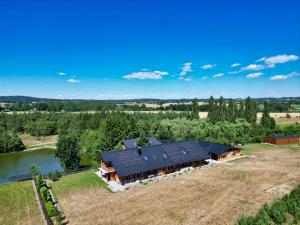 an aerial view of a house with solar panels on it at Usedlost u rybníka in Velký Bor