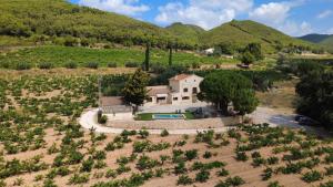 an aerial view of a house in a field at Casa Rural Cal Martí in El Pla de Manlleu