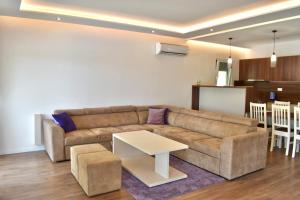 a living room with a couch and a table at Villa Blanco in Mostar
